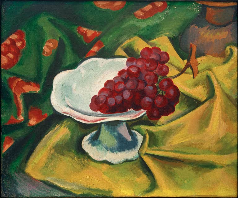 Rote Trauben in weißer Schale auf gelbem Tuch vor grünem Grund – Max Pechstein Trauben Kunstkopie